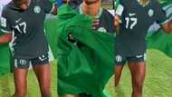 Beautiful Nigerian female footballer dances and makes unique moves while holding country flag in Video