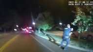 US officials urge calm after releasing video of police killing Black man
