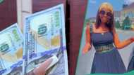 Nigerian lady receives N300, 000 from wealthy friend in Abuja as sallah gift, flaunts the dollar notes