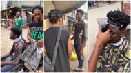 "See as the guy fresh": Nigerian barber with great skill gives stranger free haircut on the street in video