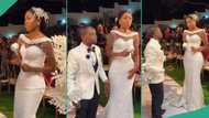 Bride with charming beauty dances gently with her husband on wedding day