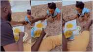 No be you dey work for money: Man slaps baby's hand away from his eba food in funny video, Nigerians react