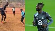Sierra Leone star who complained about bed in Nigeria hotel alights from car to play with a group of local children