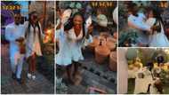 Tobi Bakre’s wife removes shoes, prepares to run, after seeing guests at her surprise birthday party