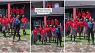 Pretty female teacher in trousers dances with her intelligent students in school, the video stirs reactions