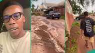 Man marvels as father drives past him in rain without giving him a ride, hilarious video trends