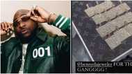 Davido makes 15 customised diamond-studded 30BG pendants for crew members, fans react to viral video