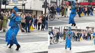 Elegant black woman in Ankara and heels causes commotion in the streets of London, dances sweetly as people stare