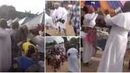 Reactions as Reverend father storms burial in sneakers, causes stir as he rains cash 'everywhere' in video