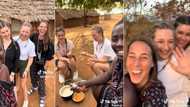 "Fresh babes": Black man carries 3 oyinbo women to Africa, video shows them riding okada, eating fufu