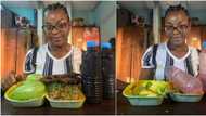 Young Nigerian lady finishes mountain of beans with stick meat, 3 mangoes & 2 bottles of zobo, many react