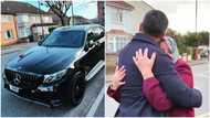 Young man buys brand new Mercedez Benz for his mother, woman becomes emotional, hugs him in photo