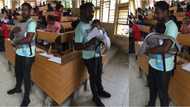 Flashback: Human kindness! This male lecturer babysits his student's twin babies so their mother can write her examination (photos)