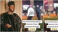 "What if he got killed?" Moment Kizz Daniel's hefty bouncer caught man dribbling him, throws him off stage