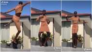 Young dark-skinned lady 'taller than house' dances in video, her height wows many online