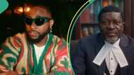 Davido respectfully bows, shakes Kanayo O Kanayo as they meet in a club: "If not he go use you do sacrifice"