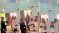 2 young men spray money on pastors in church, 'dish' new notes into offering basin, video goes viral