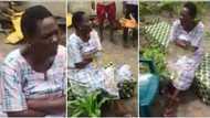 Double wahala for dead body: Video shows Nigerian lady sitting on coffin, refuses to stand up, stuns many