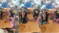 Little Nigerian girl displays tailoring skills as she operates machine like a pro in cute video, many hail her