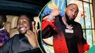 Davido's cousin Tunji roars as singer crops him out of a photo, fans react: "Clout chasing family"