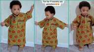"Wetin be this?" Reactions as little boy in UK rocks oversized cloth grandma sent from Nigeria