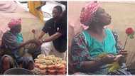 "She remembered her youth": Old woman selling groundnut gets rose flower, blows kiss to man who gave it to her