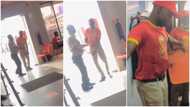 Security men at restaurant dance, open doors for customers in video, Nigerians 'roast' them in comment section
