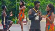 Man goes on one knee in public, proposes to his beautiful girlfriend, many people react