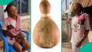 Nigerian lady who used calabash as her piggy bank displays what she found after breaking it