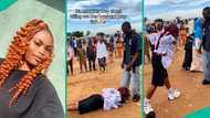 Female graduate lies down to prostrate for her man who supported her financially in school