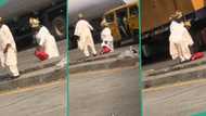 "See love": Old man holds his wife romantically, helps her climb road divider, video trends online