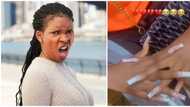 "Pele o, who send you?" Viral video of lady with damaged fingers after fixing nails sparks reactions