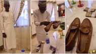 Gateman stunned as his Nigerian madam gifts him N802k Louis Vuitton shoe & bundles of cash in video