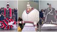 "Is this fashion?" Reactions to video of runway show featuring models in strange clothes