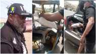 Nigerian policeman shares bag of rice to women and keke driver on the road in video, people pray for him