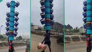 "Nigeria my country": Man perfectly arranges 20 coolers and carries them on his head, video trends