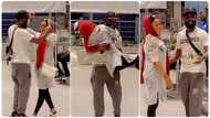 Man surprises wife at UK airport after he tells her to wait for his friend and collect package in video