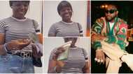 Video as Davido finally fulfills promise to hotel worker, she shows off $10,000 cash she received from singer