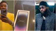 Davido’s cleaner held spellbound as singer buys him a brand new iPhone 14 Pro Max, video trends