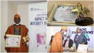 Nigerian man who returned thousands of dollars mistakenly paid into his bank account bags award, photos drop
