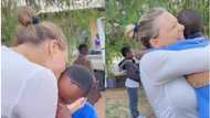 "They called her mummy": Emotional video of oyinbo woman happy to receive love from children goes viral