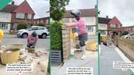Oyinbos react as woman abroad builds wall for her house, mixes cement in video