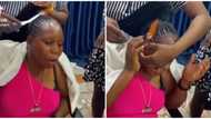 Hairstyle hacks: Stylist uses fire to smoothing lady's braided hairdo, netizens concerned