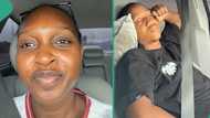 Lady happy as her man sleeps off in the car while she's driving him on major highway