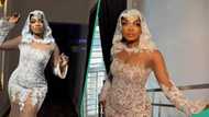 Bride slays in stylish wedding dress, gets accolades, video trends: "E be like u dey beef corset"