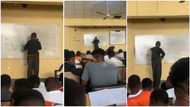UNN lecturer gets stuck on the board while solving Physics question in viral video, students laugh