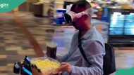 Living in 3034: Young man arrives to buy popcorn on his robot-like bicycle and 4D spectacle