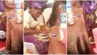 Reactions as well-dressed woman is caught in viral video putting food she was served at party into a nylon