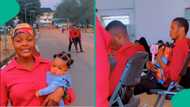 Nigerian man who is medical student comes to school with his little child, listens to lectures