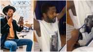 Kneel down and raise up your hands: Nigerian man 'punished' by his woman in funny video for eating outside